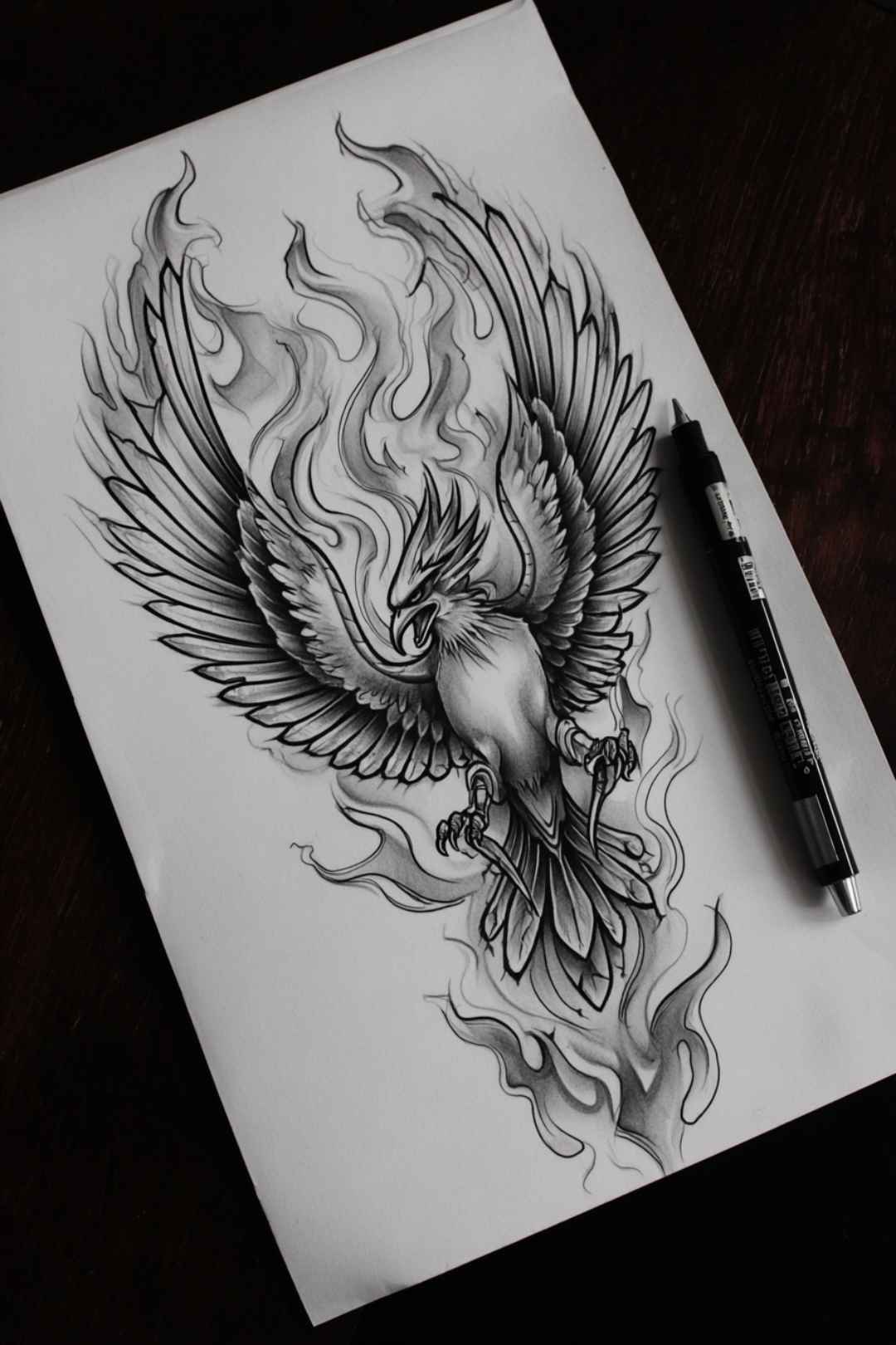 Phoenix half sleeve tattoo drawing with sweeping fiery feathers rising up the arm