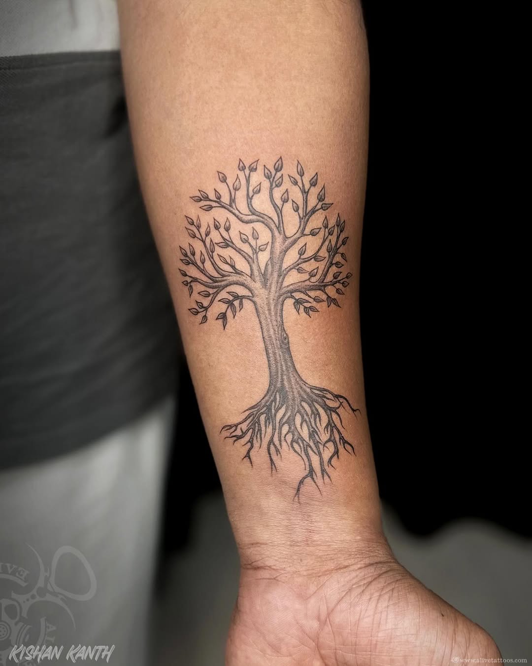 Tree with visible roots sobriety tattoo representing a grounded recovery