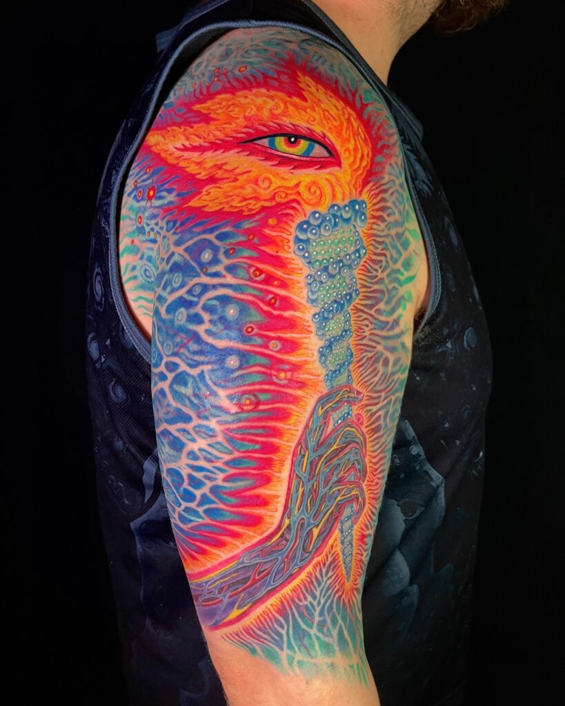 Psychedelic colorful sleeve tattoo with swirling rainbow patterns and optical distortion.