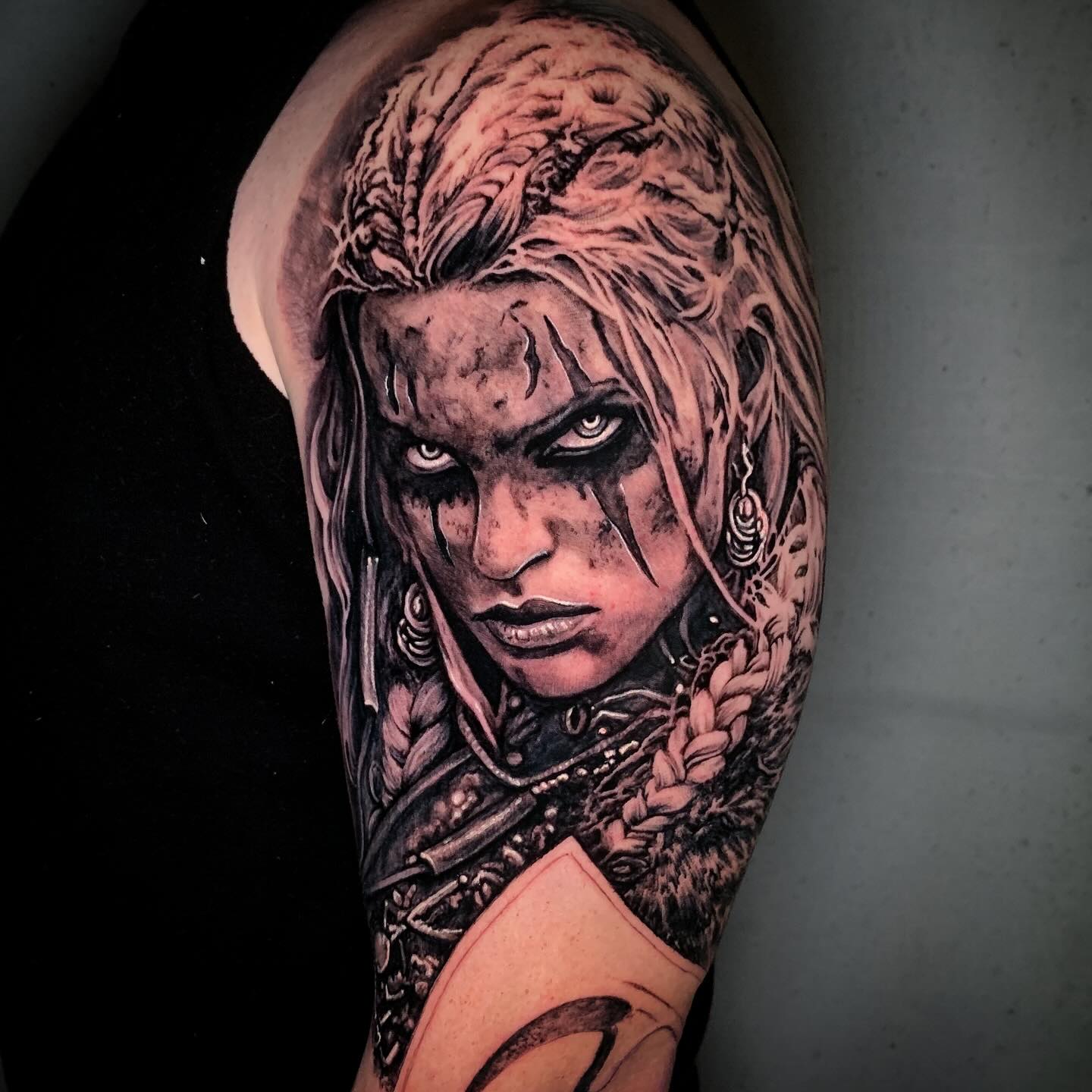Warrior woman silhouette strength tattoo for women in solid blackwork