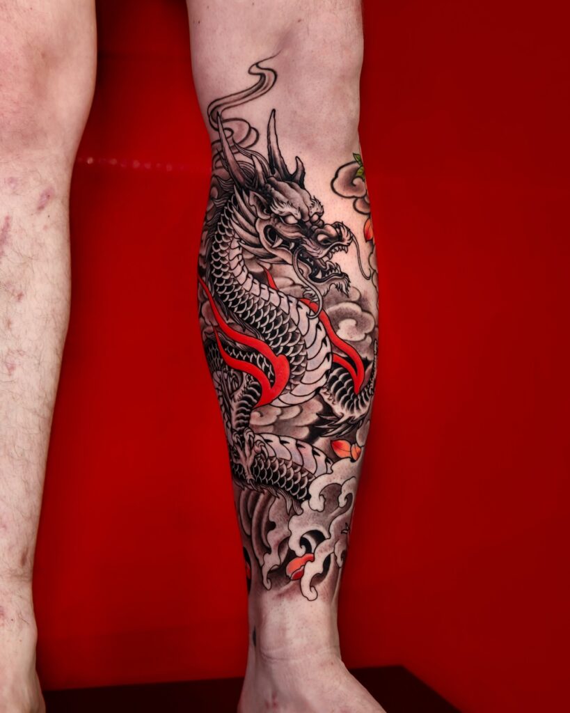 Neo-traditional dragon tattoo for women with bold outlines and saturated colour packing