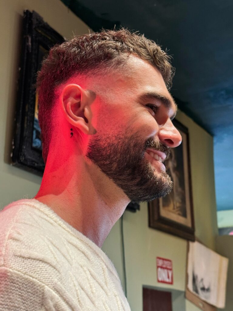 Semicolon tattoo for men, a small meaningful tattoo linked to mental health survival