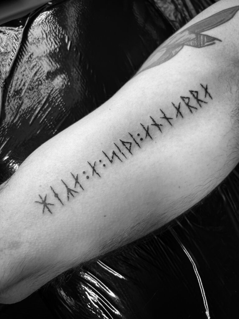 Single Elder Futhark rune tattoo for men, a small meaningful tattoo with Norse symbolism