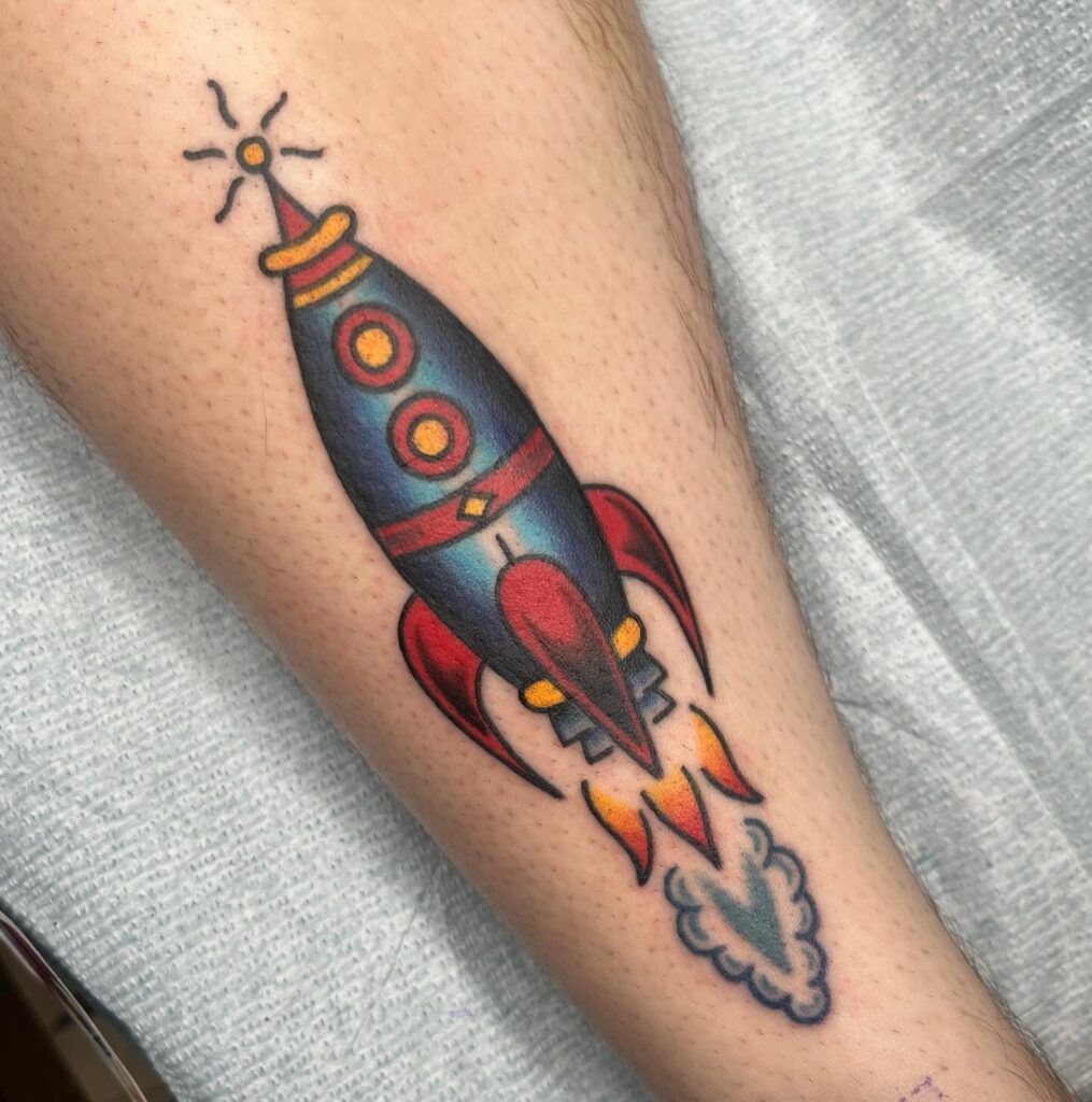 Rocket ship space tattoo drawn in bold traditional linework