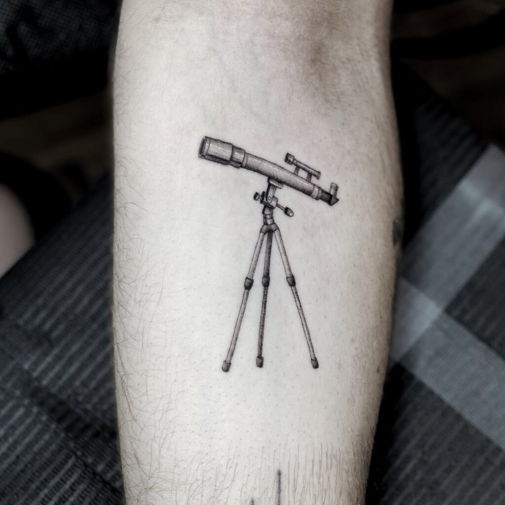 Space telescope tattoo of an orbiting observatory rendered in fine line detail