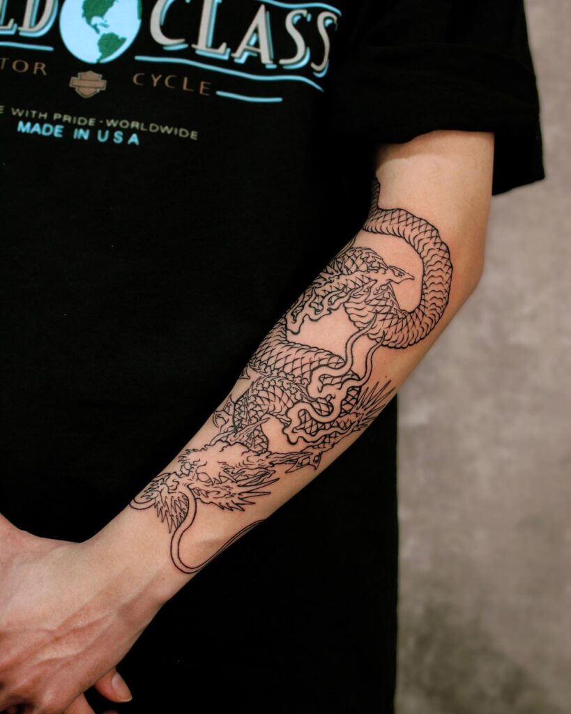 Fine line Eastern dragon tattoo for women running down the forearm in thin black linework