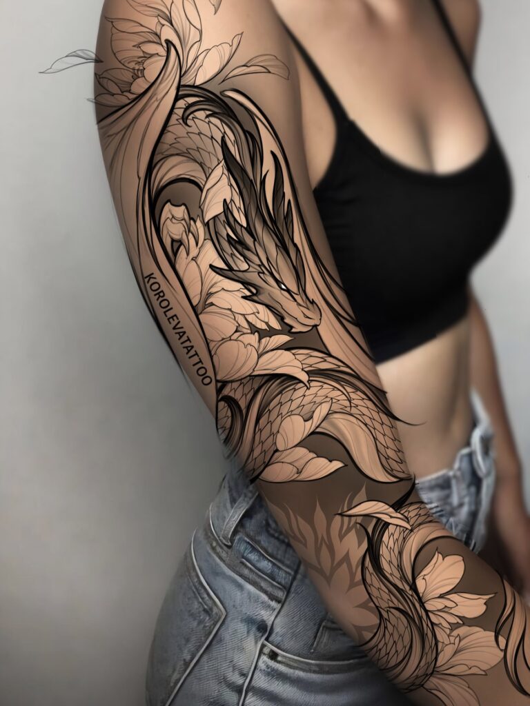 Feminine Western dragon tattoo for women with spread wings and a slender four-legged body