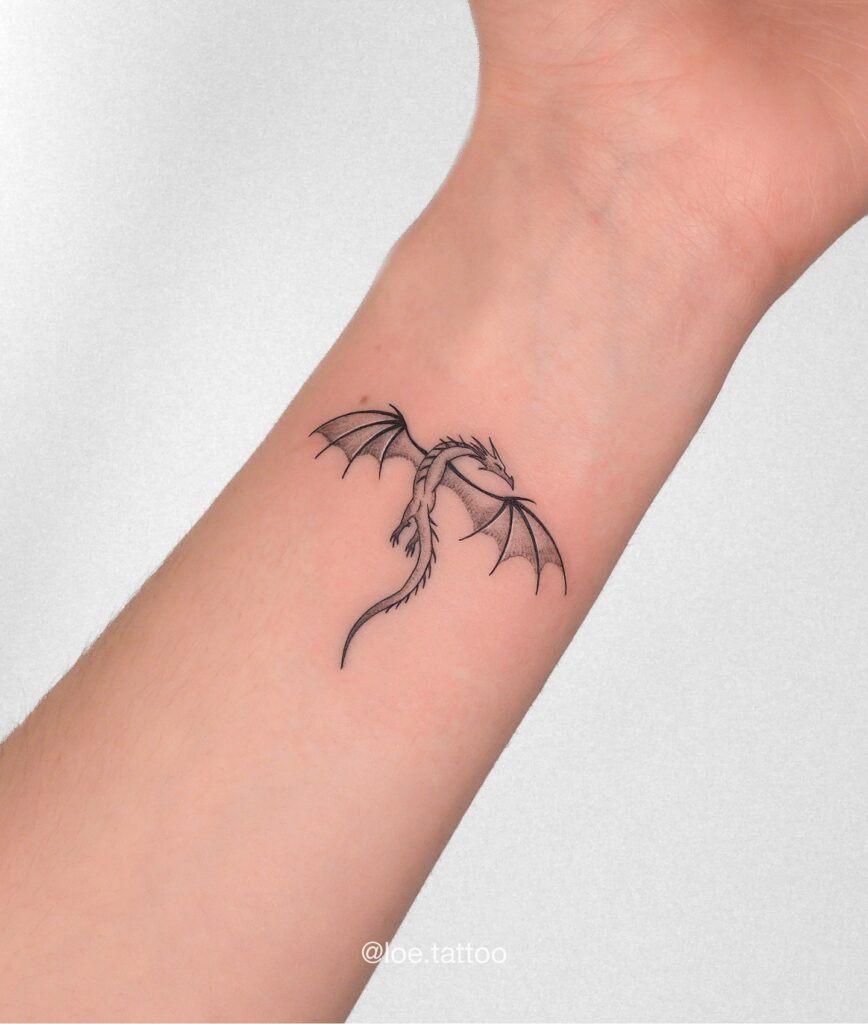 Blackwork dragon tattoo for women filling the ribcage with heavy shading
