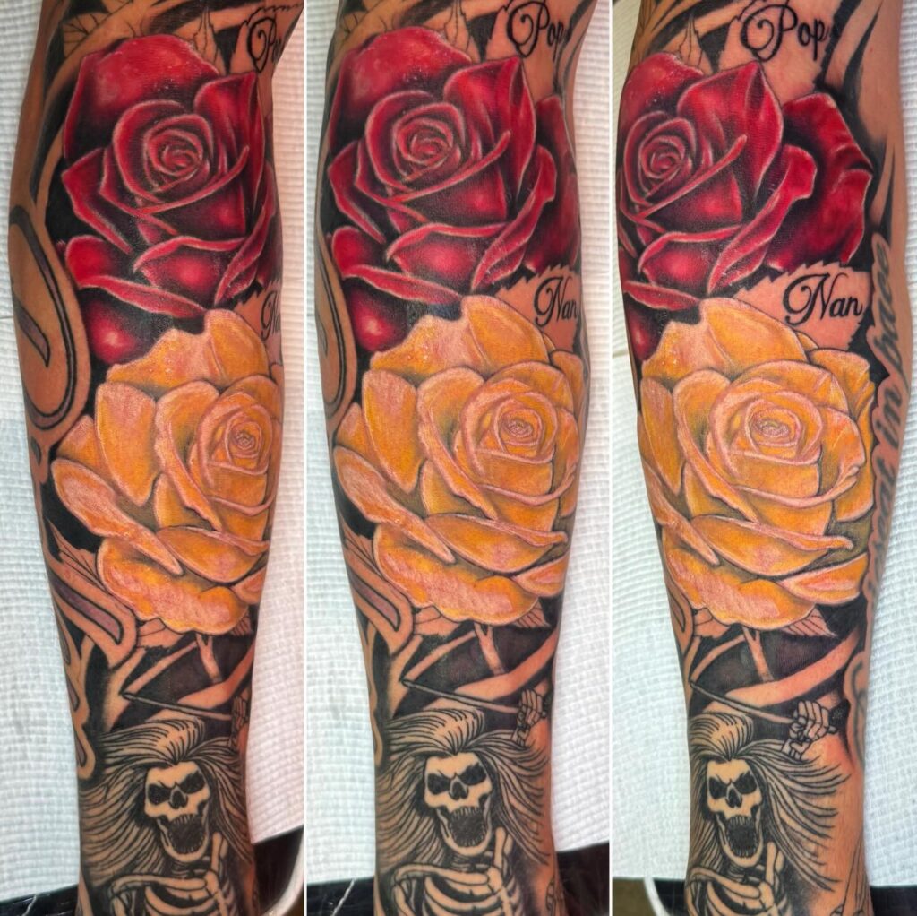 Single colour rose sleeve tattoo worked entirely in one unified ink tone