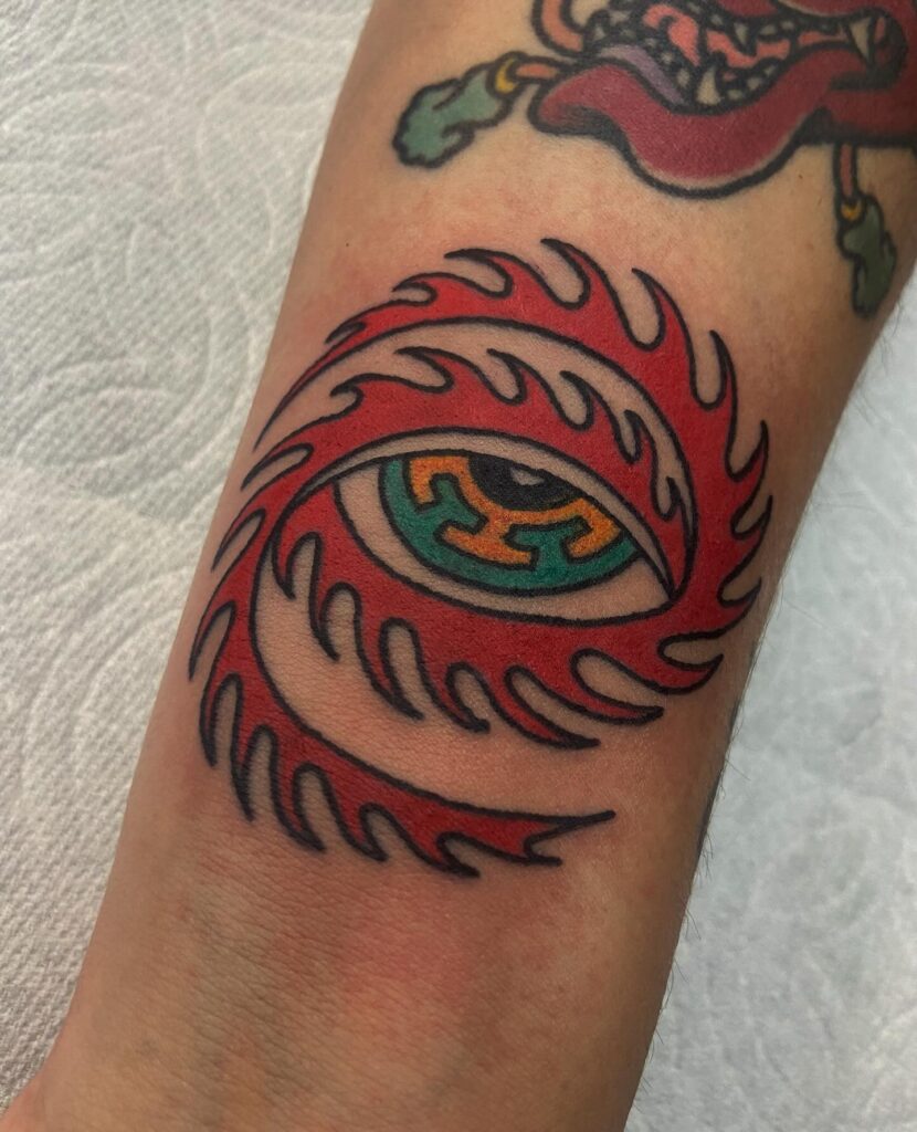 Cosmic eye space tattoo blending an eye with stars and nebula texture