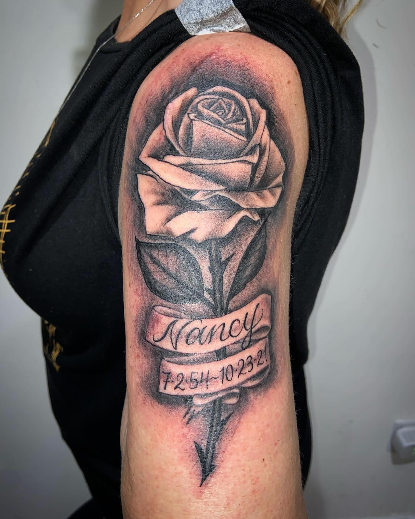 Rose and name banner RIP tattoo in traditional style